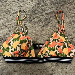 Bathing suit top, grapefruits and oranges